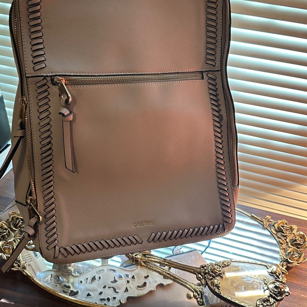 Calpak Tan Backpack with Sleek Design and Decorative Stitching
